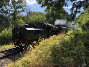 A steam train on the severn valley line running passed Bank Farm