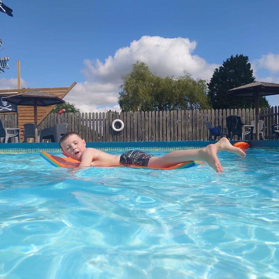 The outdoor heated swimming pool at Bank Farm Holiday Park