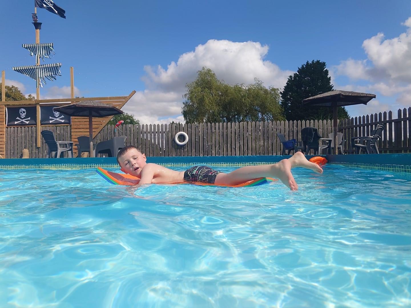 The outdoor heated swimming pool at Bank Farm Holiday Park