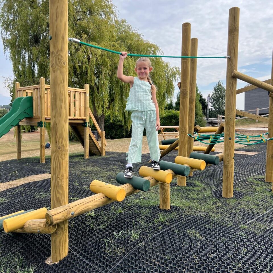 Children's play area climbing frame with girl