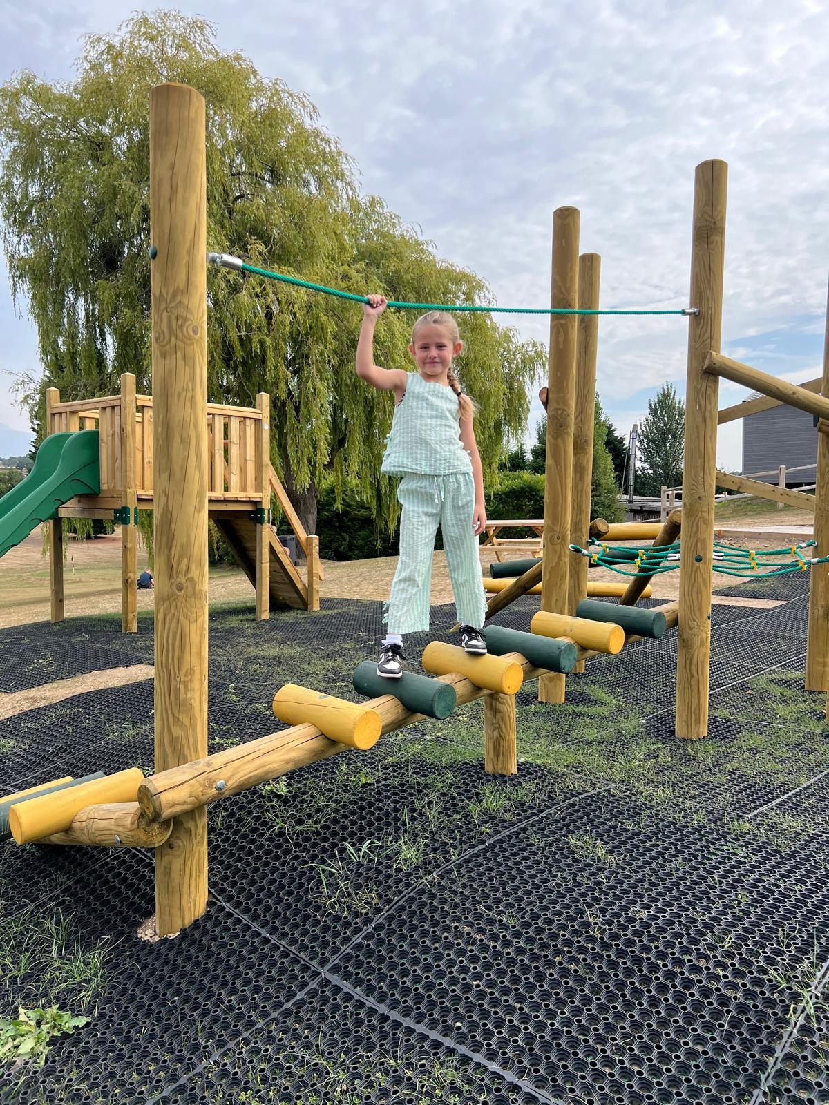 Children's play area climbing frame with girl