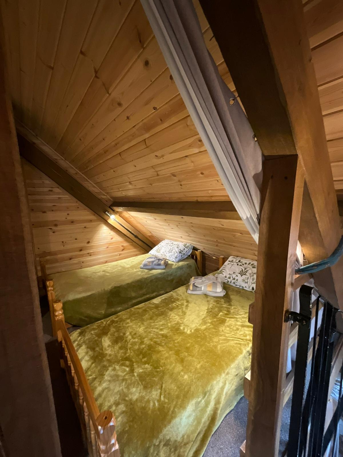 two of the single beds in a pod within the Bank Farm glamping lodge