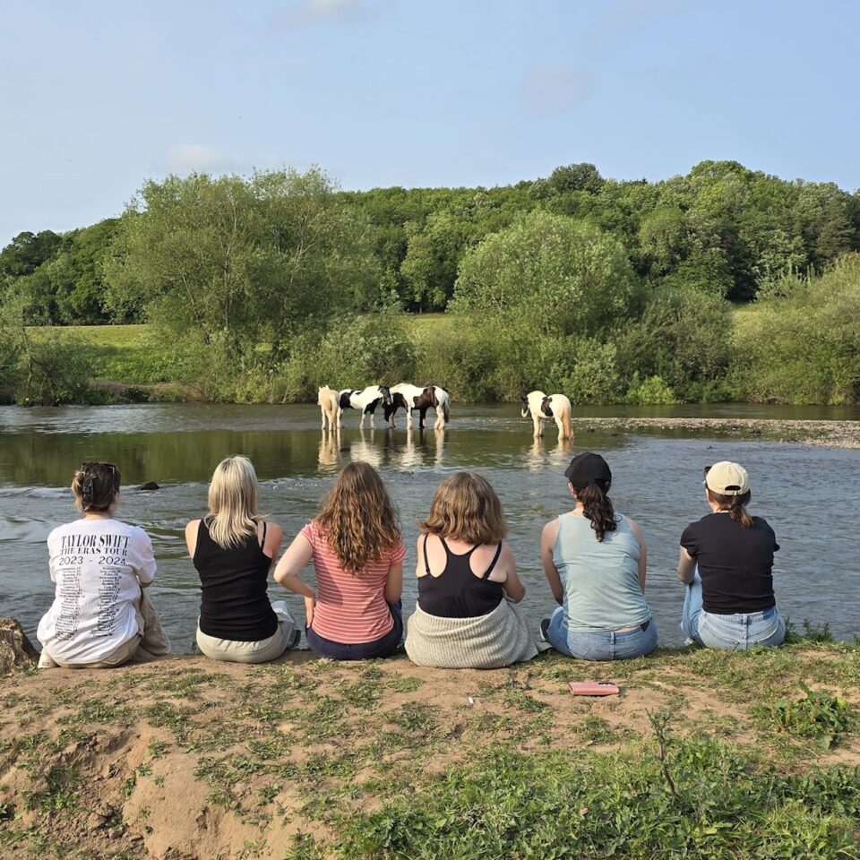 Equestrian guests enjoying the river bank